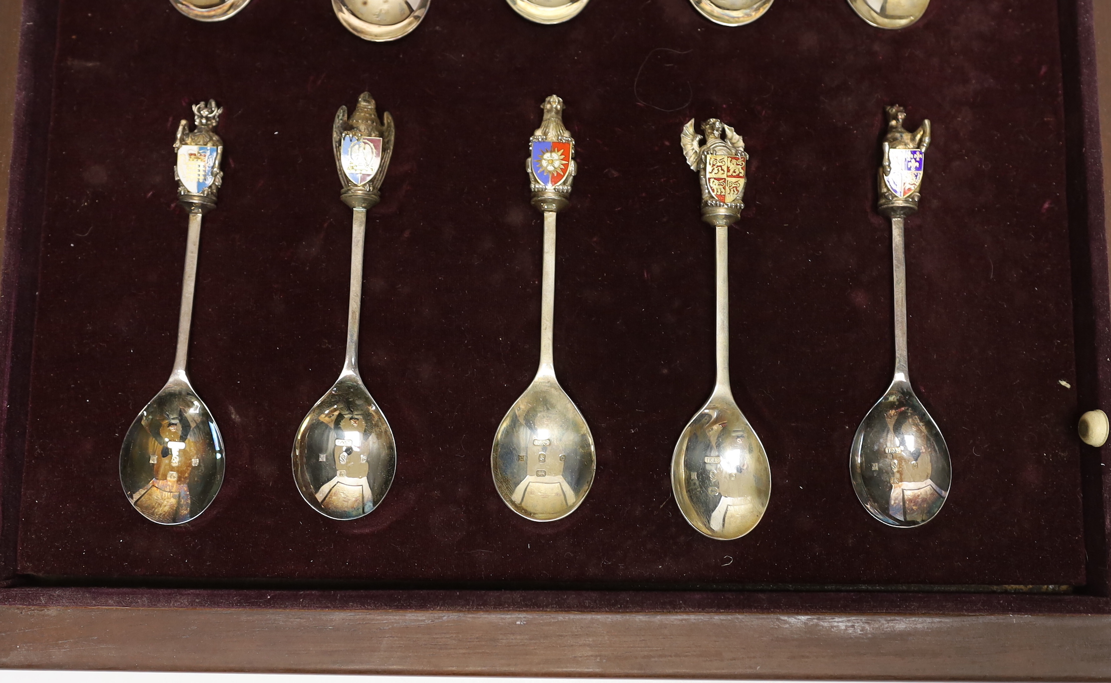 A Queen Elizabeth II Limited Edition cased set of ten 'The Queen's Beasts Collection' silver and enamel spoons, Toye, Kenning & Spencer, London, 1977, 14cm, numbered 929/2500.